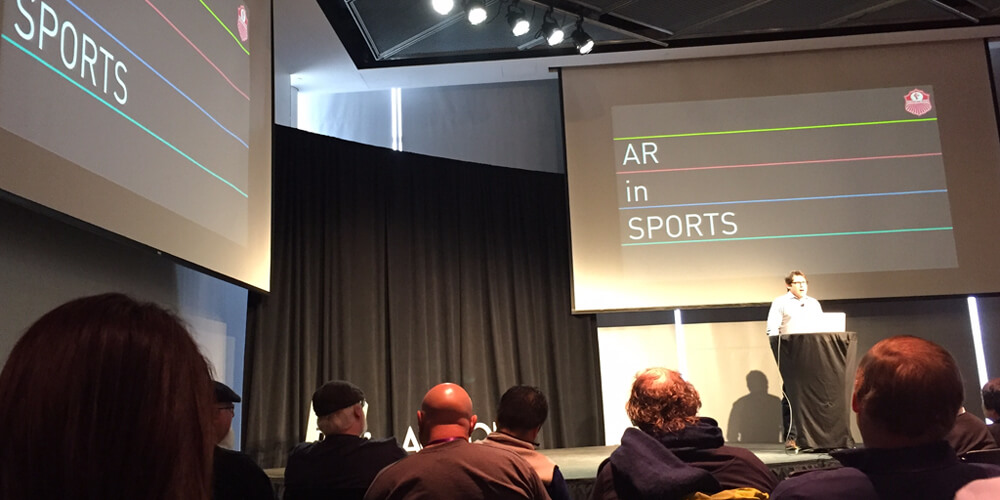Josh McHugh speaking at an AR in Sports event